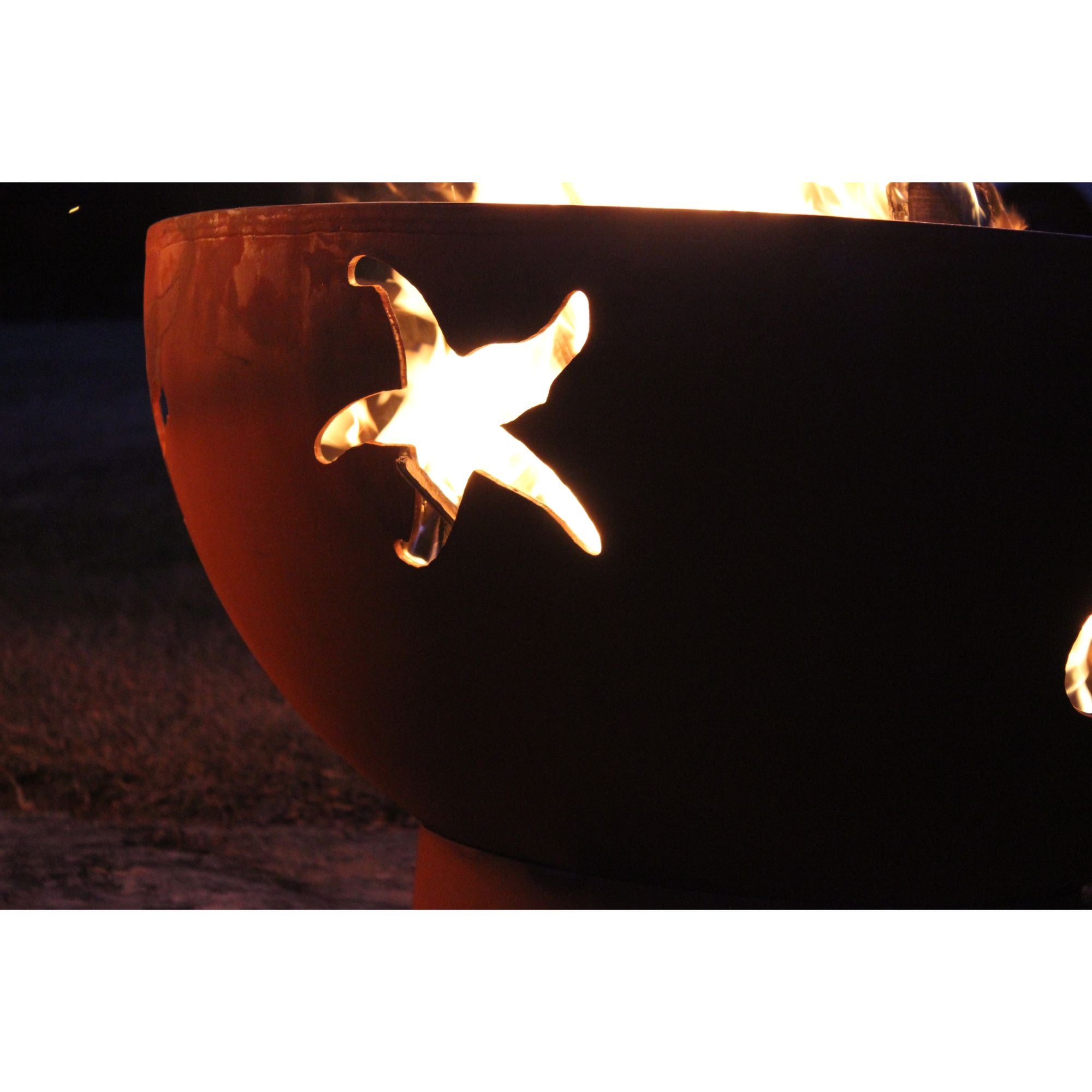 Fire pit with starfish design on a dark background