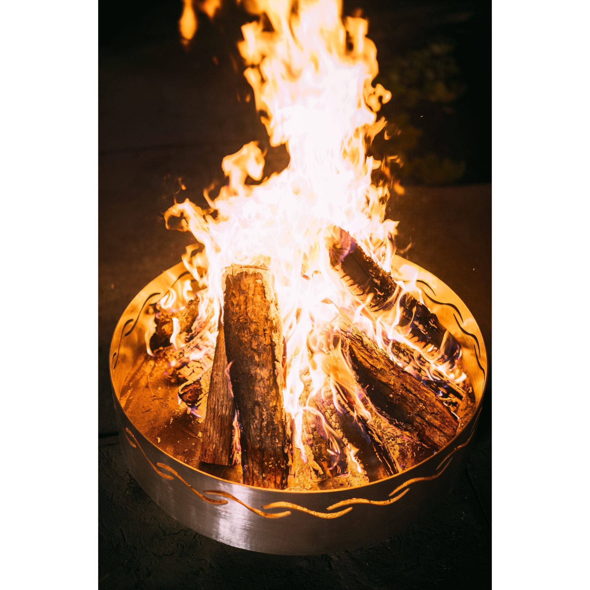 Fire pit with burning logs and flames on a dark background