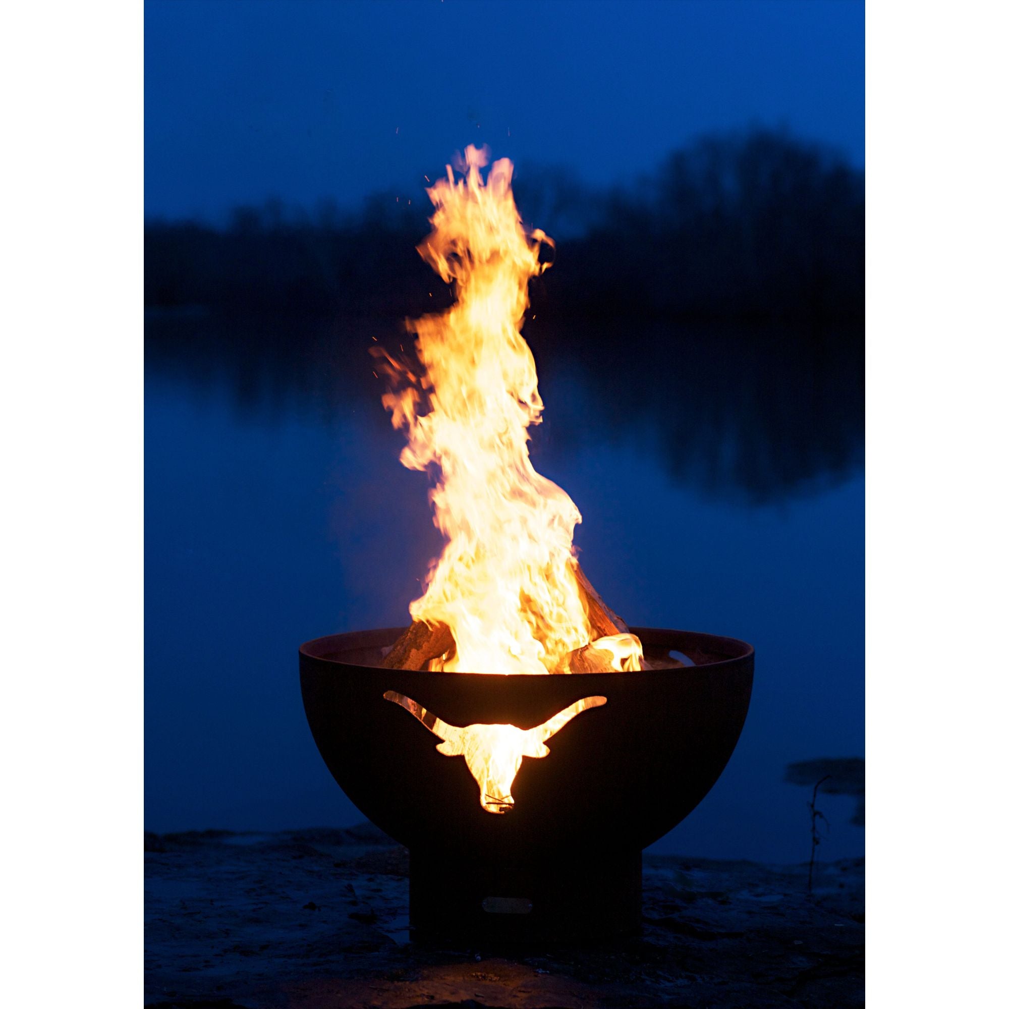 Fire pit with flames burning brightly against a dark background