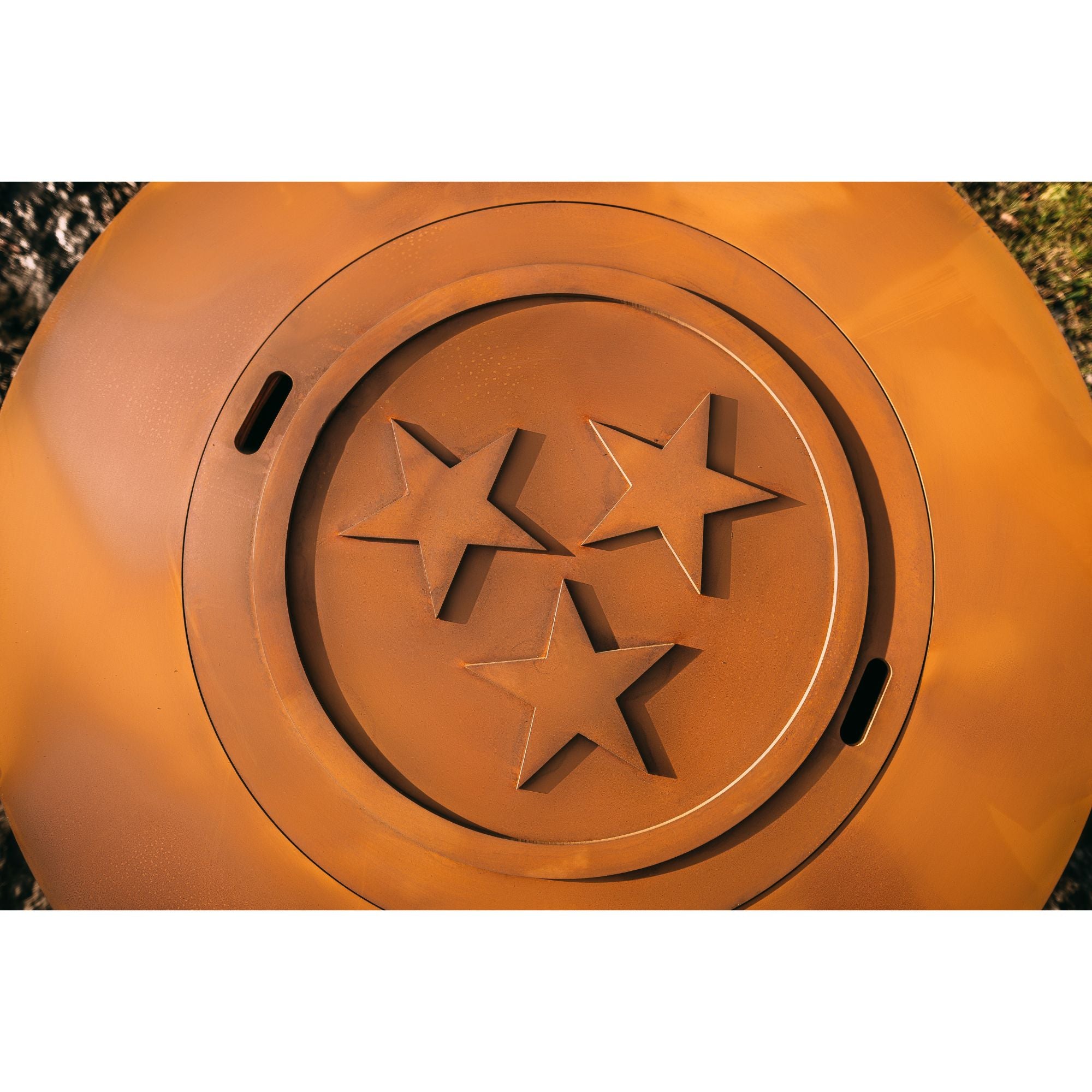 Fire pit lid with stars in an outdoor setting