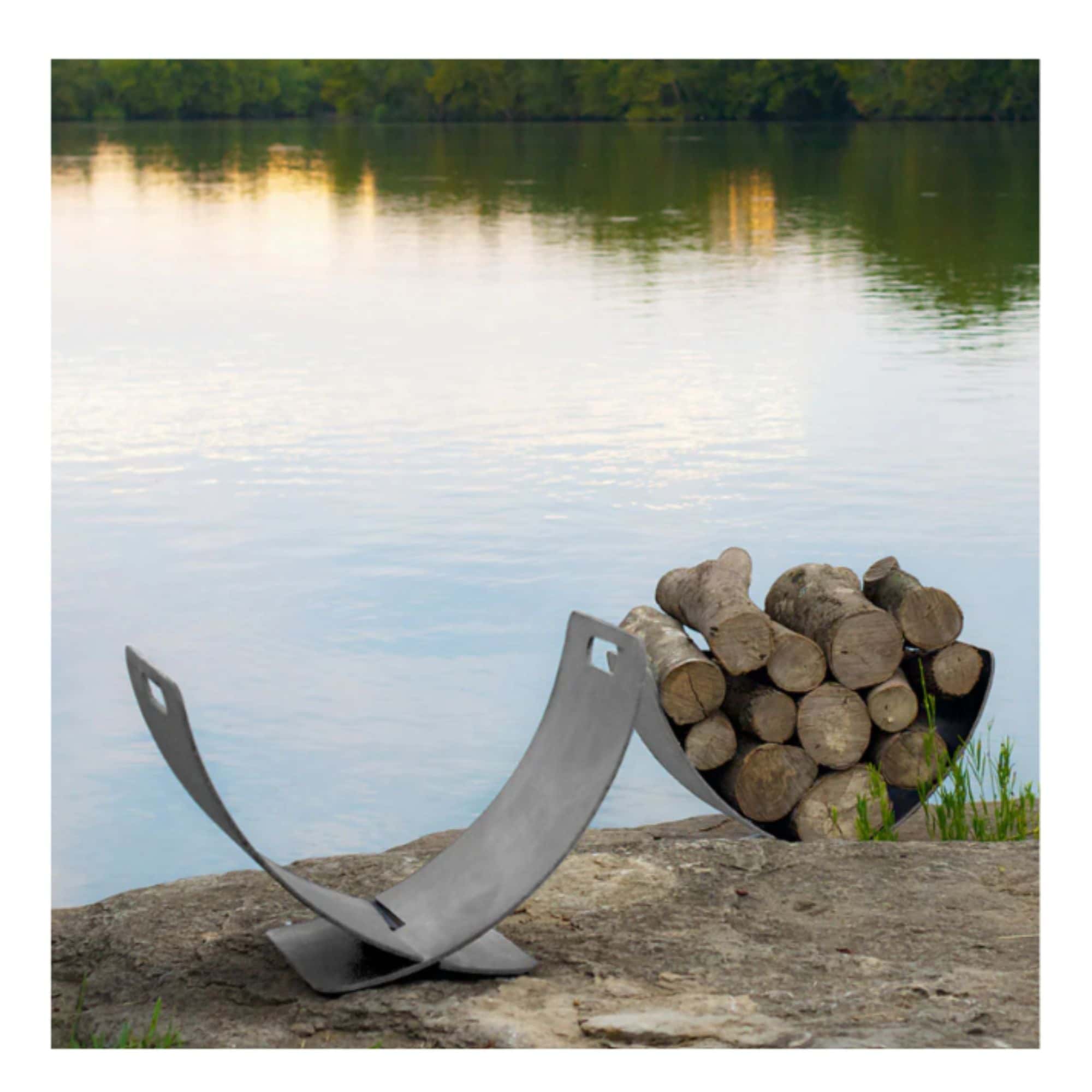 steel firewood log rack holder with logs against a lake backdrop