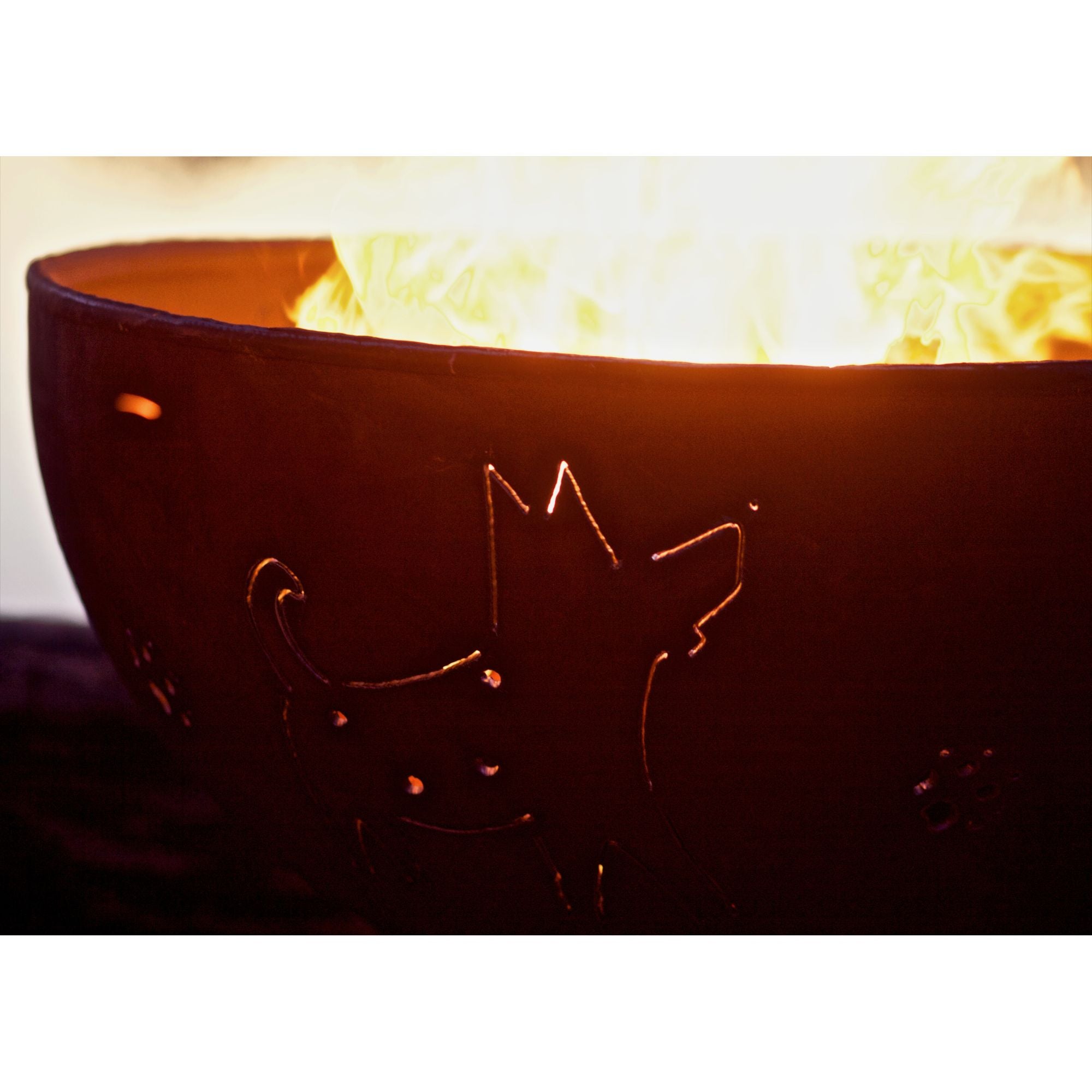 Fire pit with a cat design on fire