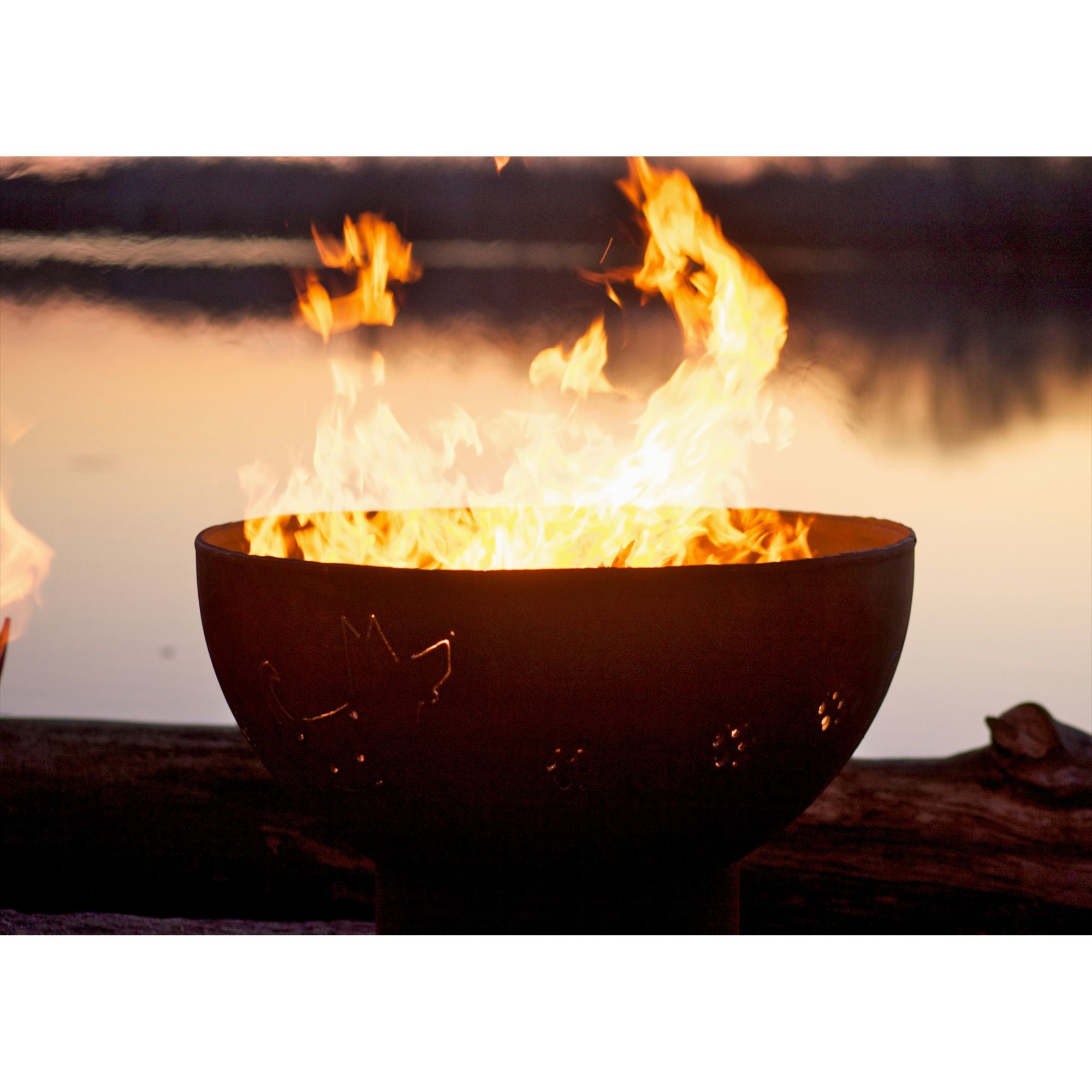 Fire pit with flames burning brightly against a dark background