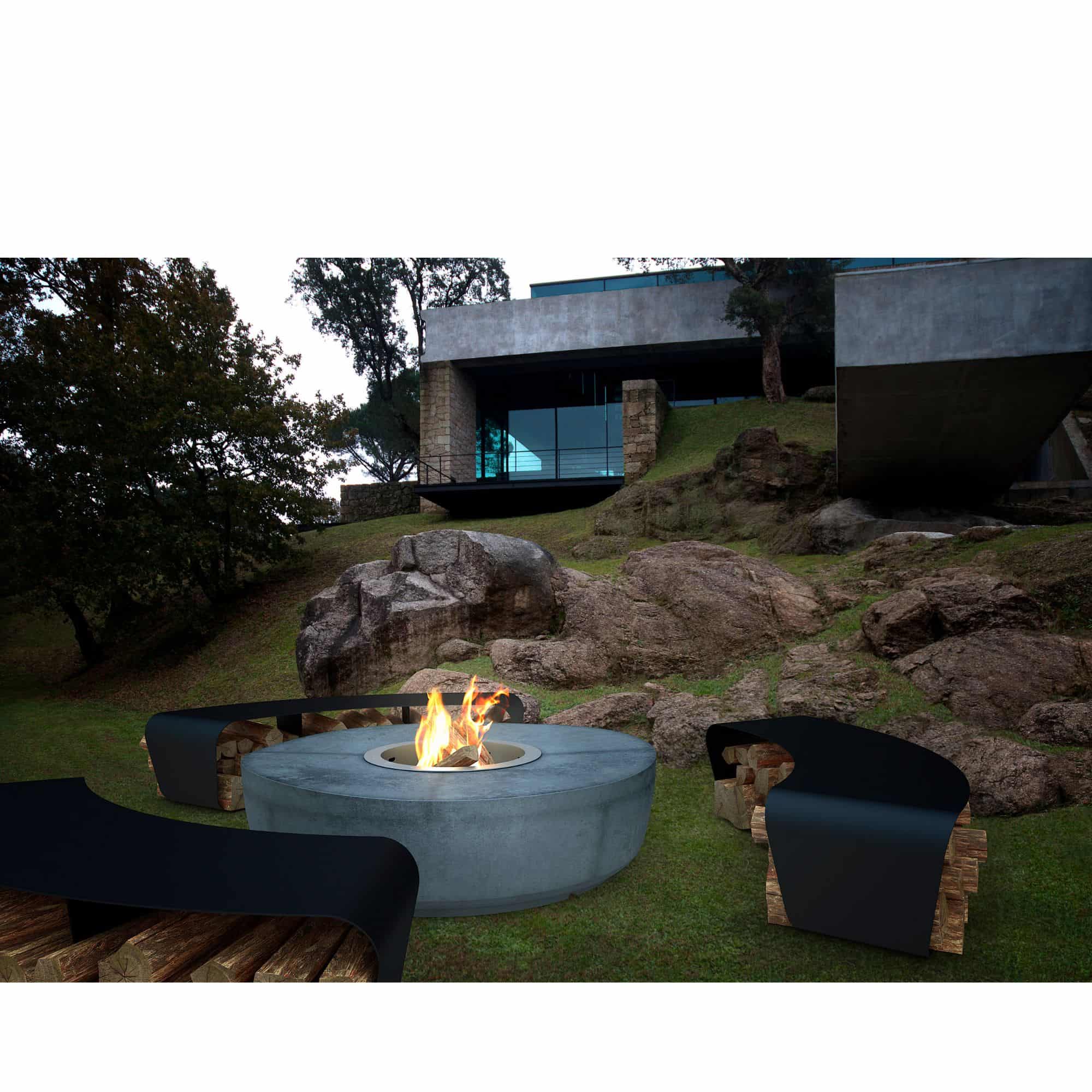 Outdoor setting with a fire pit and modern building in the background