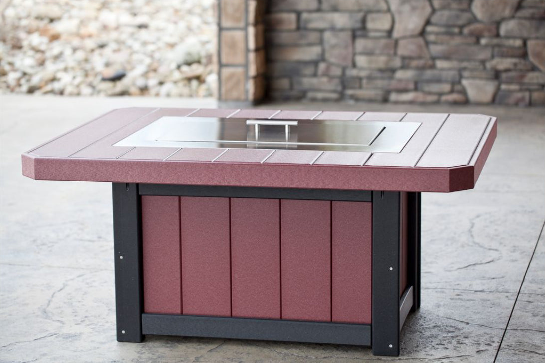 cherry wood colored firepit with lid on a stone floor