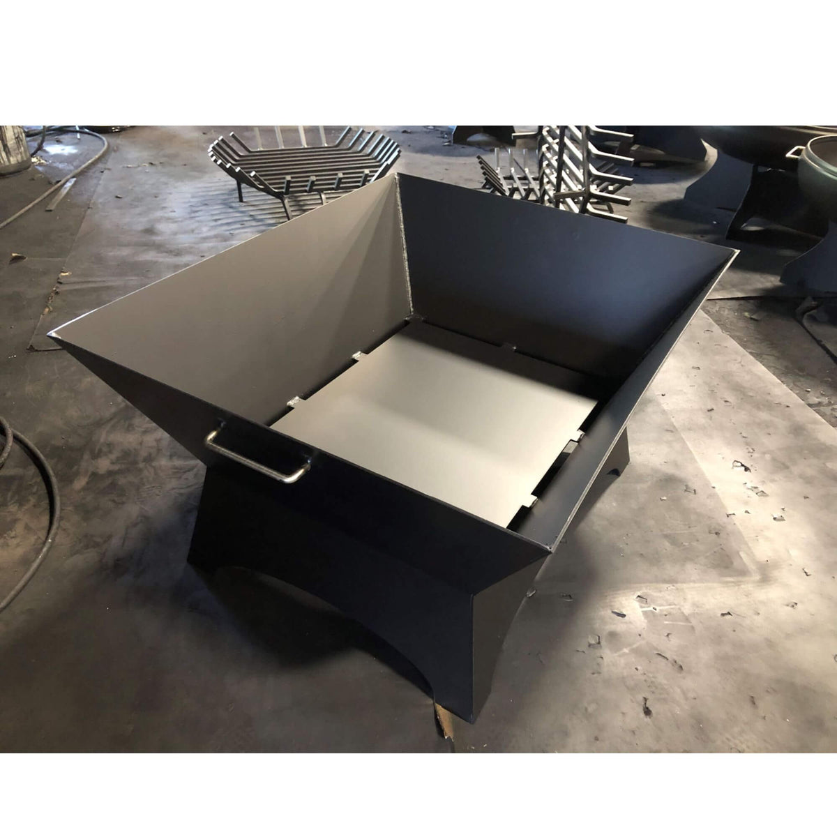 Master Flame square welded steel fire pit, angle view without grate