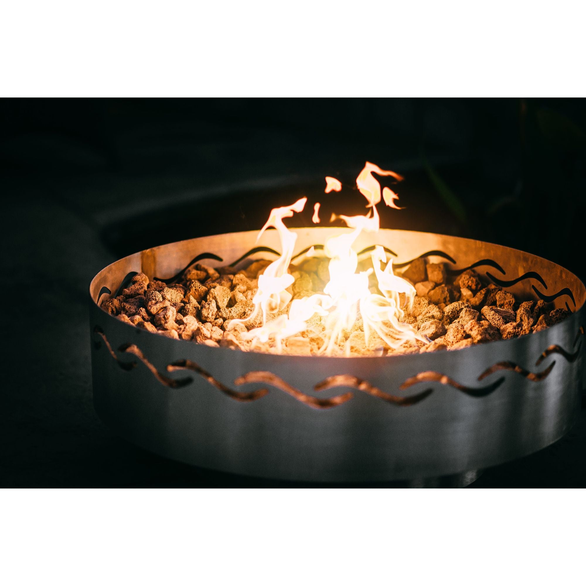 Fire pit with flames burning inside on a black background