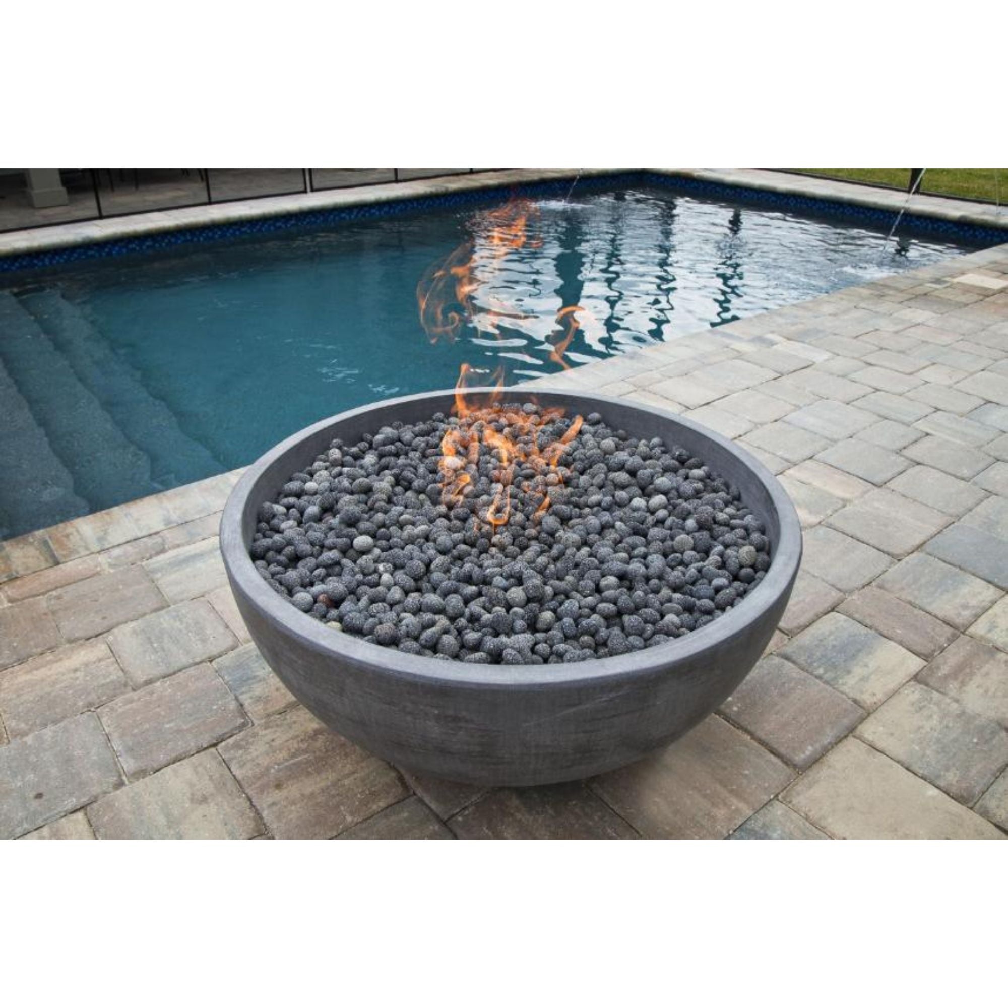 fire bowl with flames by a pool