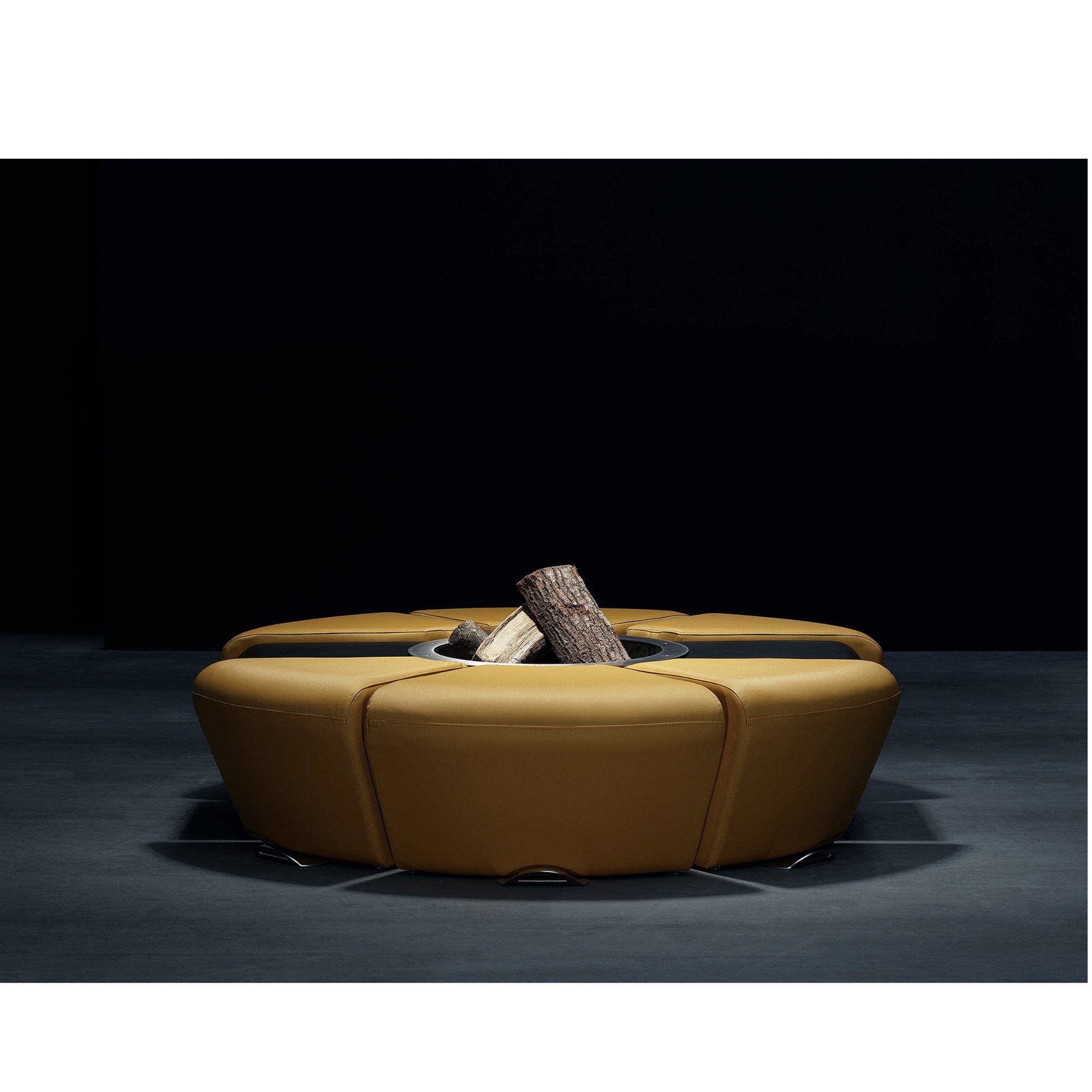 Orange leather fire pit table with logs on a dark background