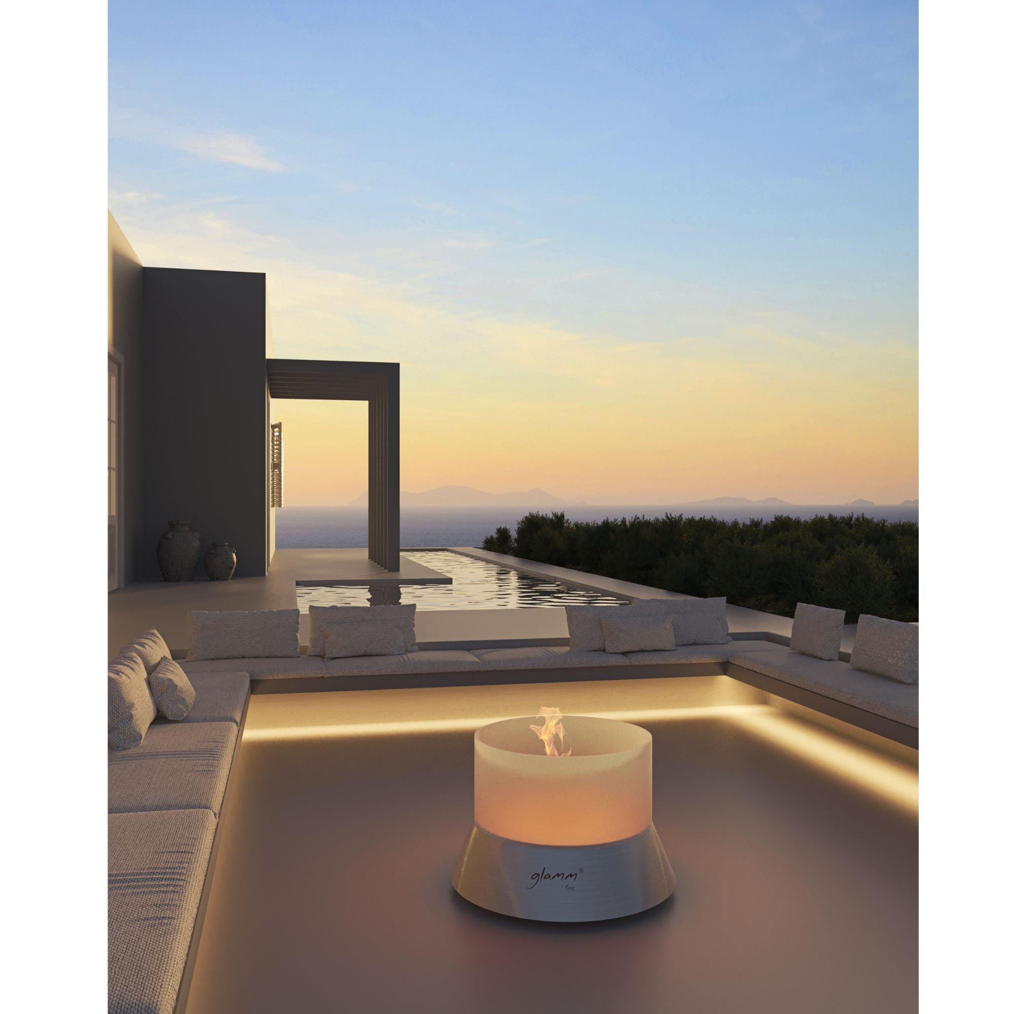 Modern outdoor setting with a fire pit table on a rooftop at sunset.