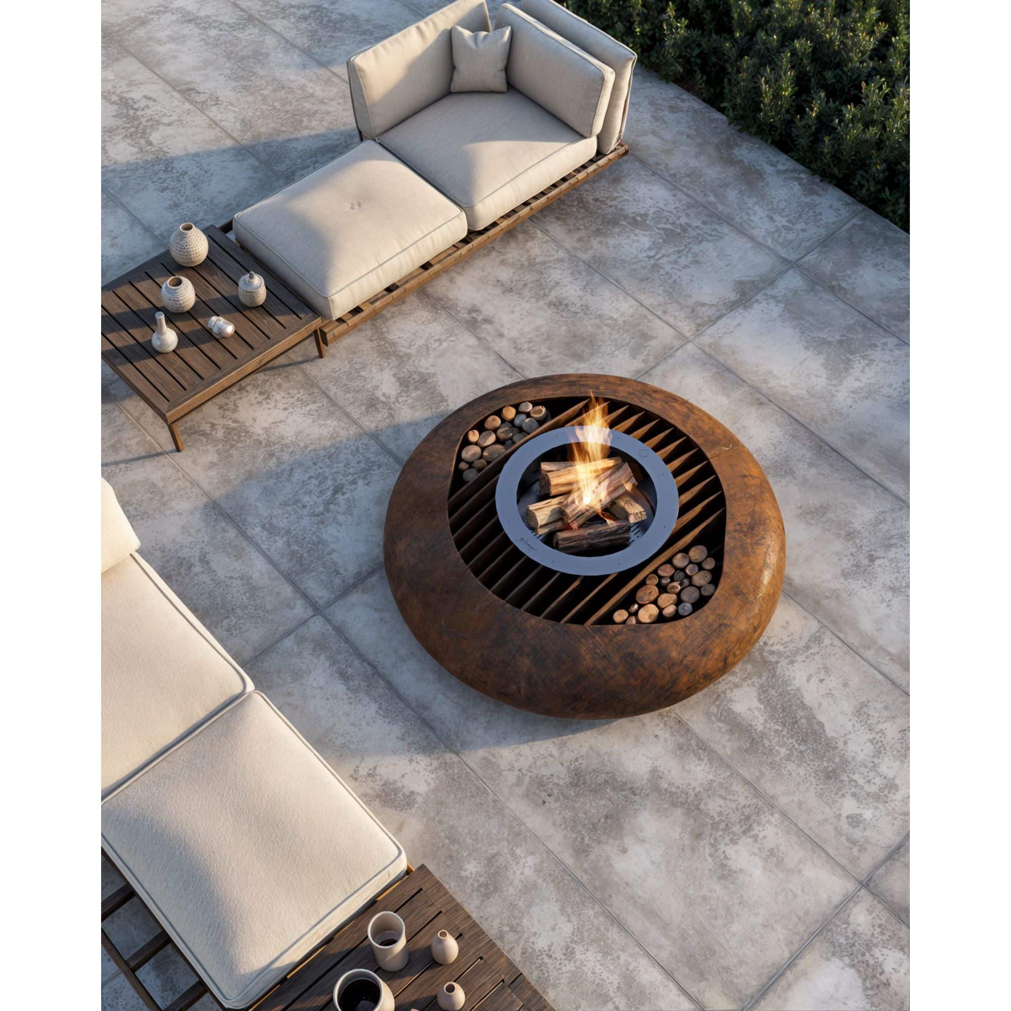 Round outdoor fire pit on a patio with seating area