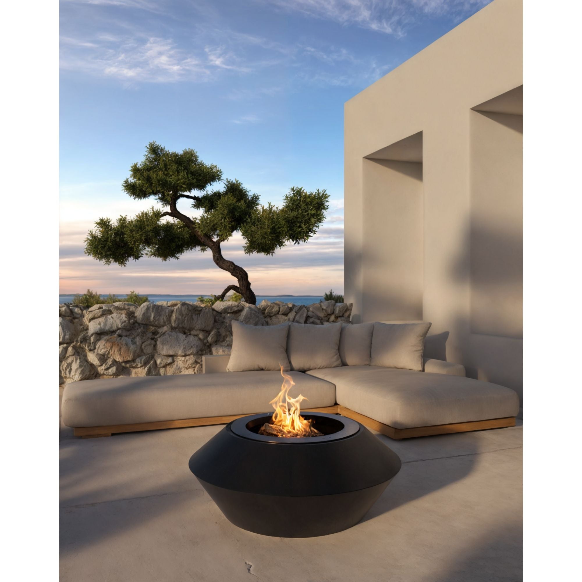 Modern outdoor seating area with a fire pit and scenic view.