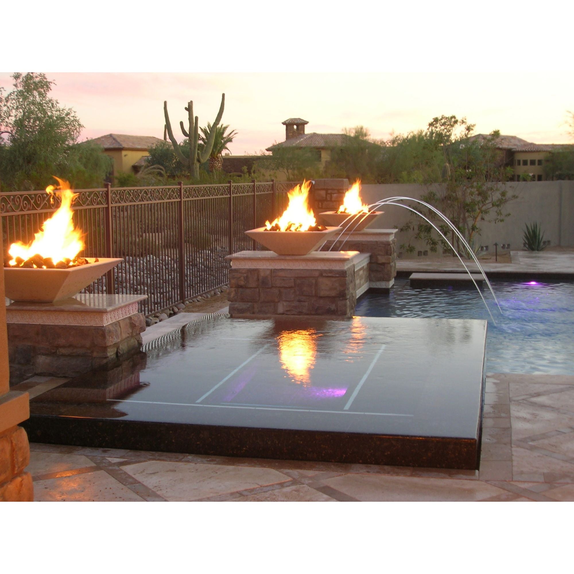 fire bowls with flames on rock pedestals