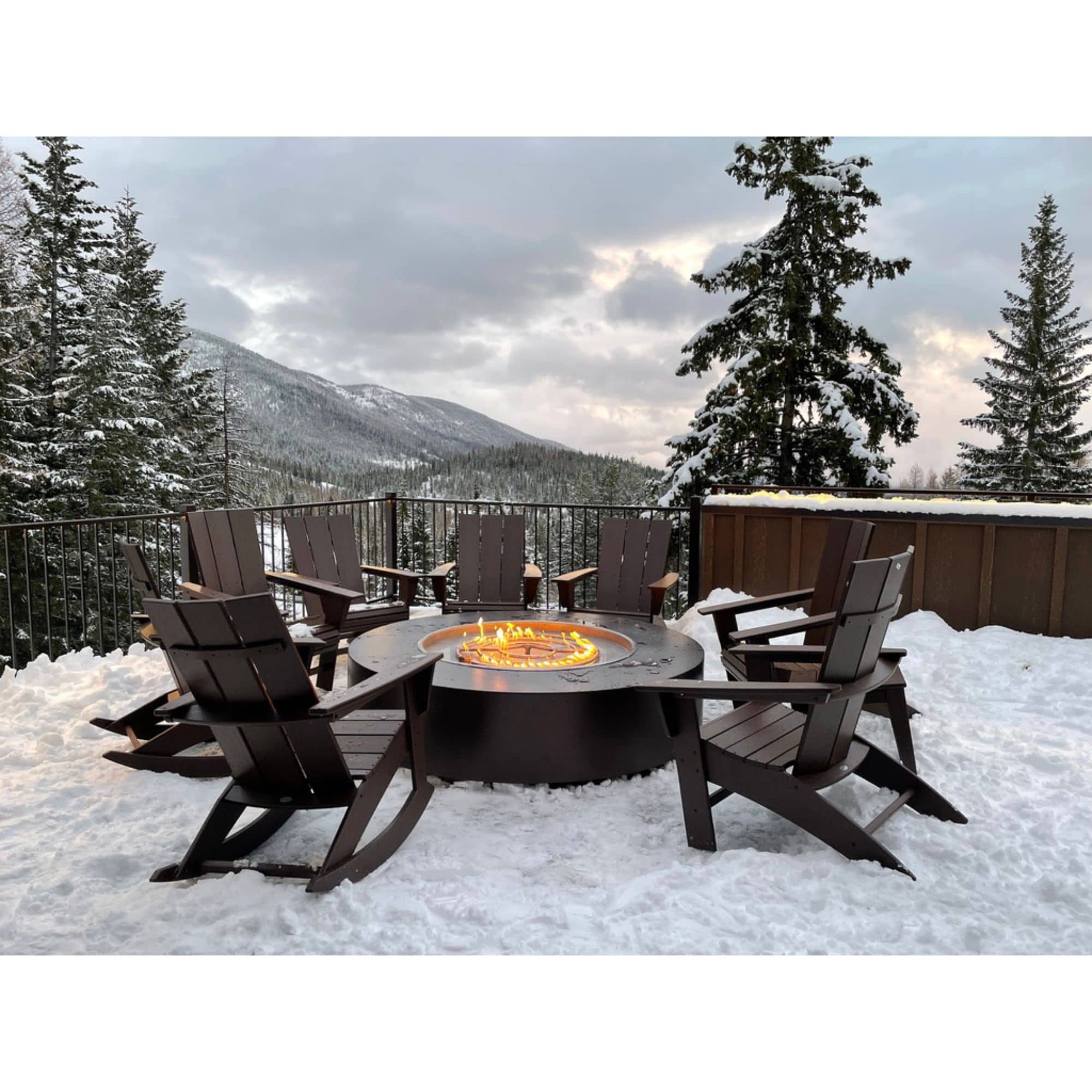 fire pit with flames, standing on snowy ground