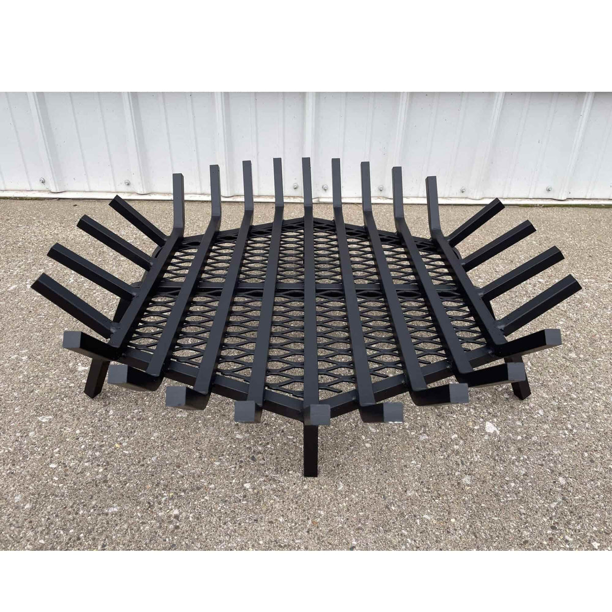 Master Flame round fire pit grate with Char-Guard ember catch, front view